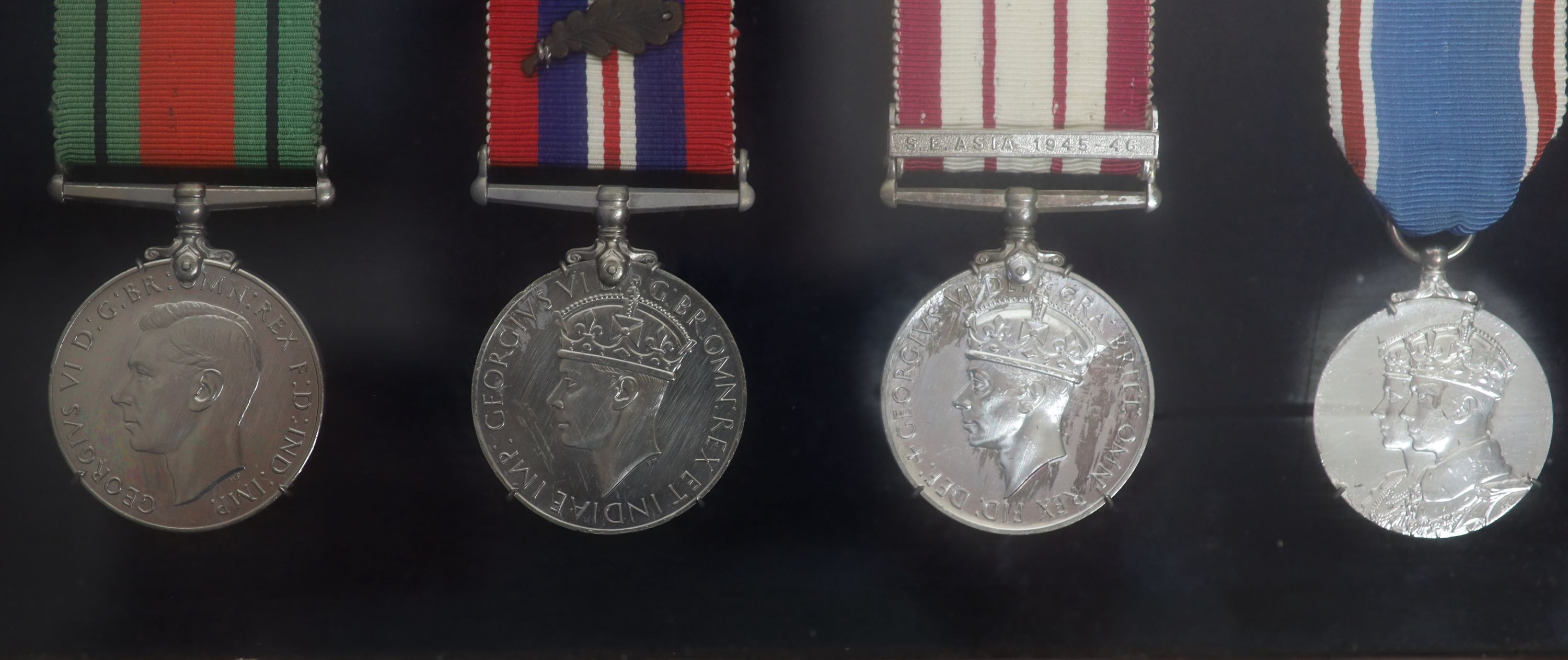 A cased WWI, WWII and Military C.B. medal group to Rear-Admiral John Dent R.N. (1899-1973) and a cased KCVO and Order of St. John to his son Sir Robin John Dent (1929-1999) Case 45.5 x 36 cm